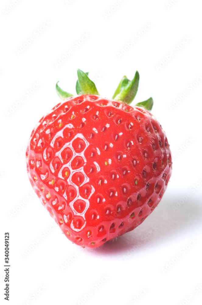 Fresh ripe red strawberry with green leaves on white background with dropped shadow. Studio shot Fresh ripe red strawberry with green leaves on white background with dropped shadow. Studio shot