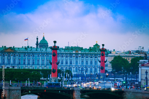 Rostralnaya Kolonna or column on Neva river over Winter Palace, Zimnij dvorets in Saint Petersburg, Russia photo