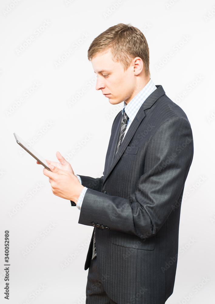 businessman at the table uses a digital tablet businessman at the table uses a digital tablet