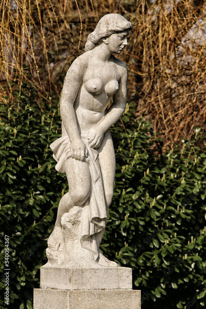 Statue of young naked lady on the pedestal