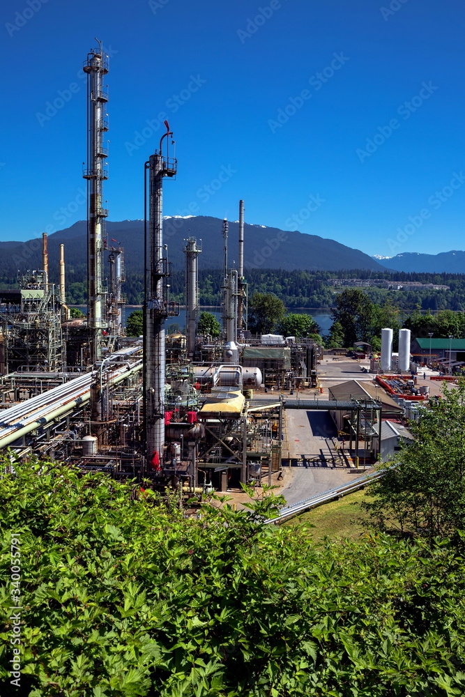 Vancouver oil refinery on a background of nature, Burrard Inlet and mountain view Vancouver oil refinery on a background of nature, Burrard Inlet and mountain view