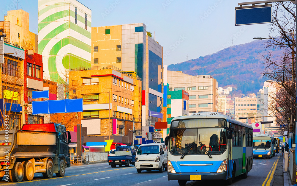 Street with road traffic in city center of Busan morning reflex