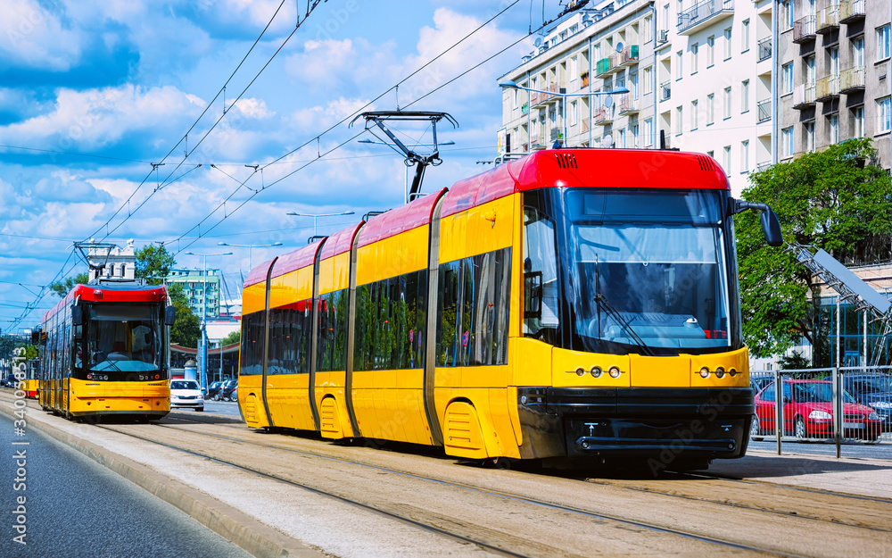 Trolleys on road in Warsaw city center reflex