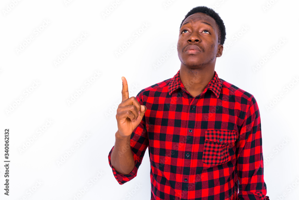 Young handsome African man against white background