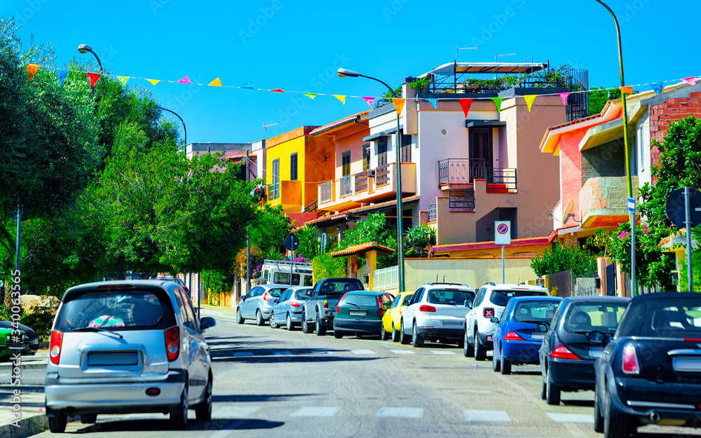 Obraz premium Street view with cars parked in Road Cagliari reflex