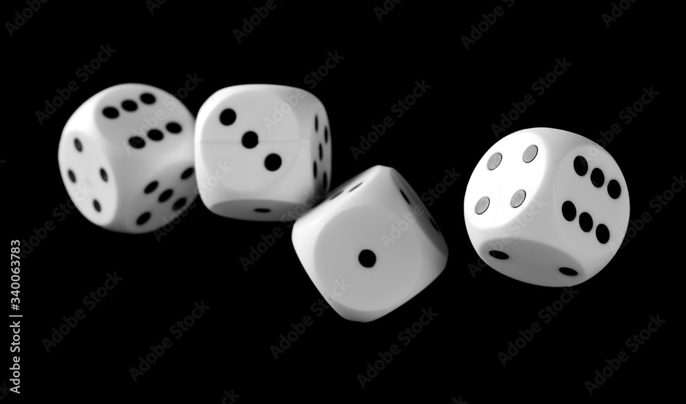 White playing, gambling die, dice for tabletop games and poker isolated on black background with clipping path White playing, gambling die, dice for tabletop games and poker isolated on black background with clipping path