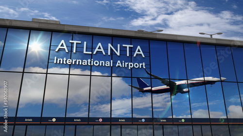 Fotografia Airplane landing at Atlanta mirrored in terminal