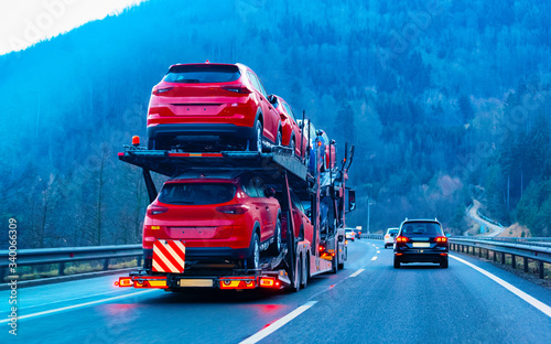 Cars carrier transporter truck on road Auto vehicles reflex