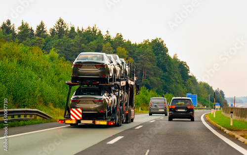 Cars carrier truck in asphalt highway road in Poland reflex © Roman Babakin