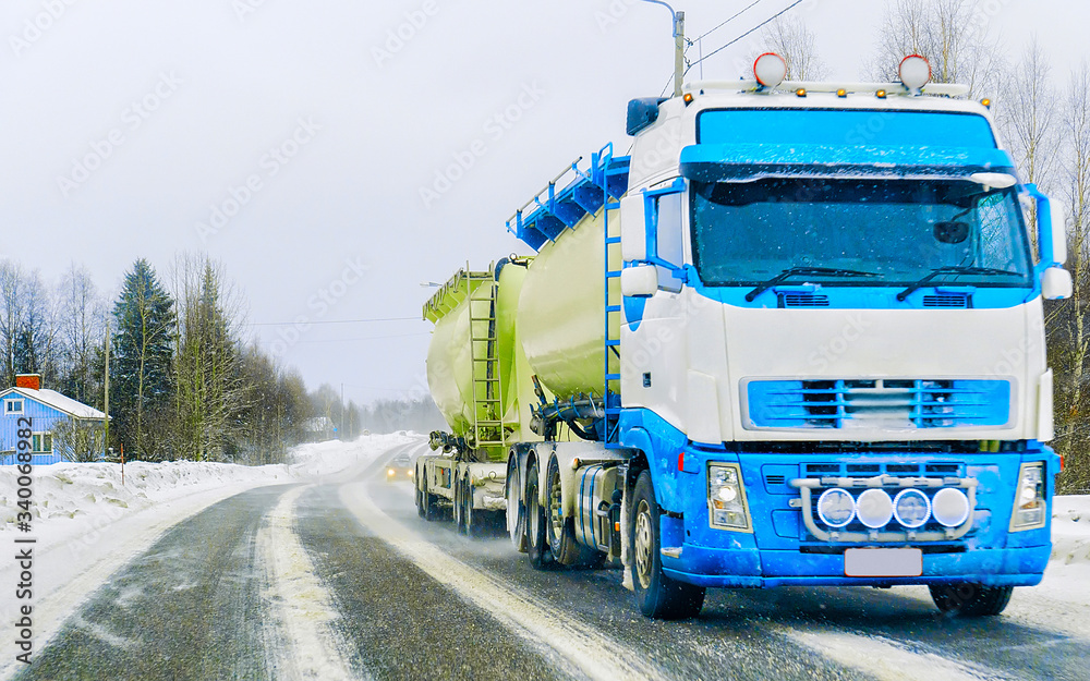 Tanker storage in road at winter Rovaniemi reflex