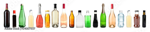 Set of bottles with different liquids on white background. Banner design