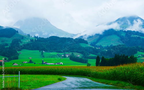 Road at Prealps mountains in Gruyere in Fribourg Switzerland reflex