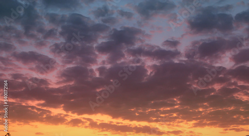 Wallpaper Mural Sunset sky, big clouds. Orange violet colors Torontodigital.ca