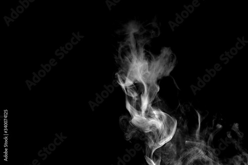 White isolated smoke on black background © gillismitch