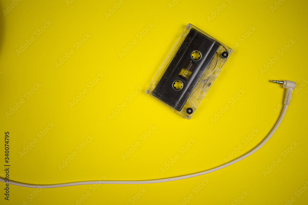 Retro audio cassette on a yellow background Retro audio cassette on a yellow background