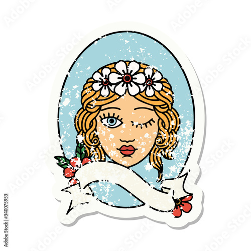 grunge sticker with banner of a maiden with crown of flowers winking