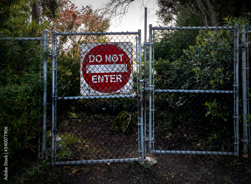 Do Not Enter Sign Behind Chainlink Fence