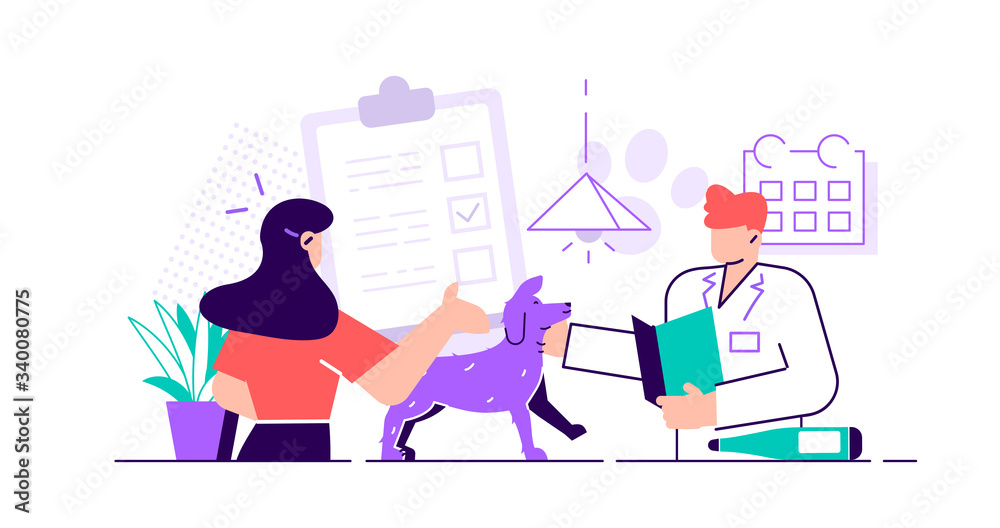 Smiling veterinarian examining dog and cat Smiling veterinarian examining dog and cat