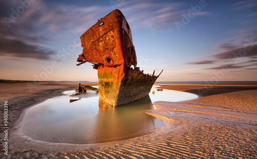 Wallpaper Mural An old shipwreck boat abandoned stand on beach or Shipwrecked off the coast of I