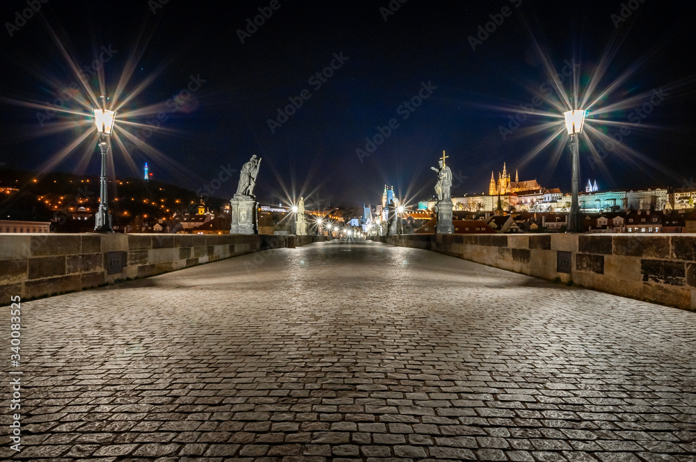 Empty Charles Bridge in Prague at night.