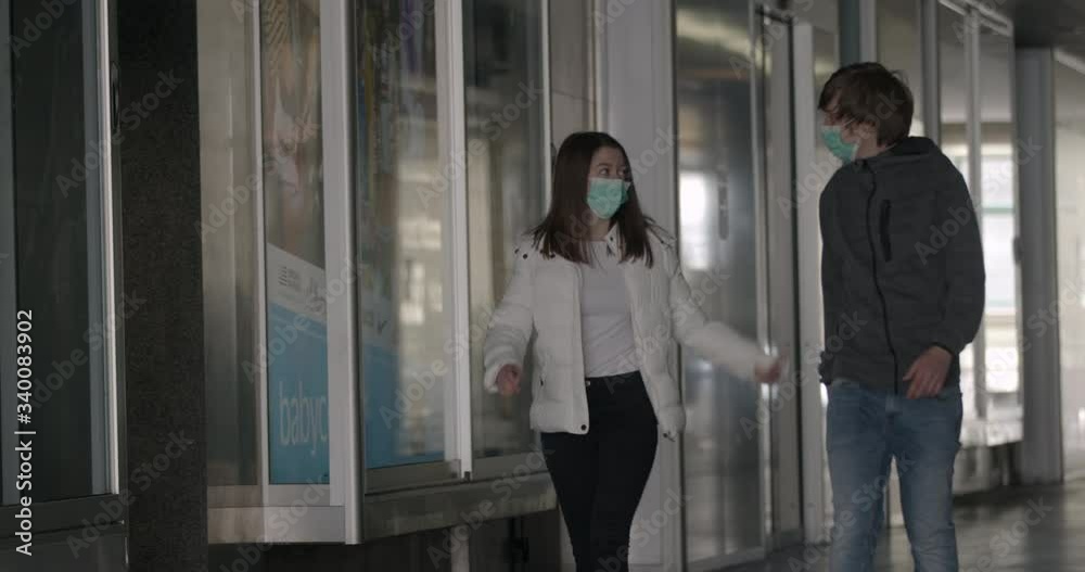Responsible social gathering in time of pandemic. People wearing face masks for protection against Covid-19. Two friends hanging out in time of coronavirus Responsible social gathering in time of pandemic. People wearing face masks for protection against Covid-19. Two friends hanging out in time of coronavirus