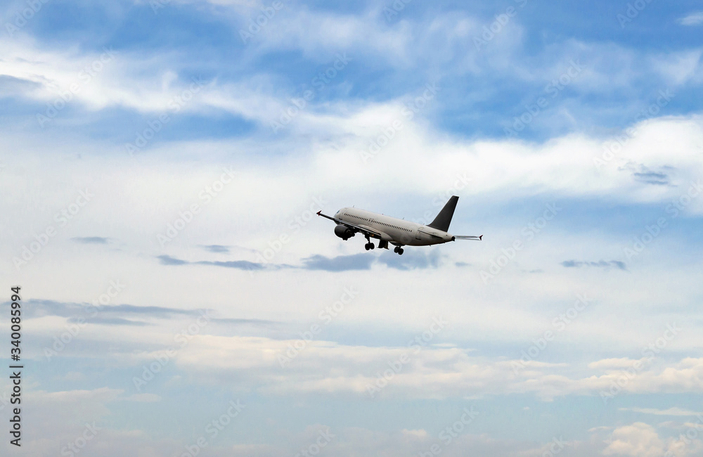 plane on take-off, in the sky among white clouds plane on take-off, in the sky among white clouds