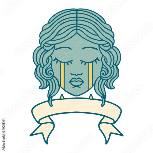 tattoo with banner of female face crying