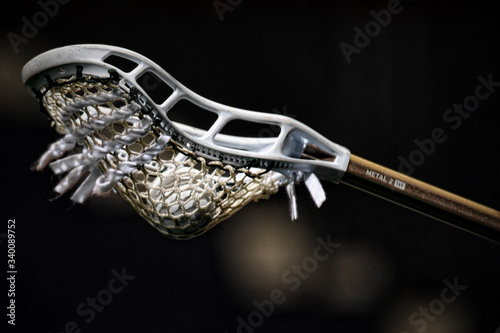 Lacrosse stick and game ball photo