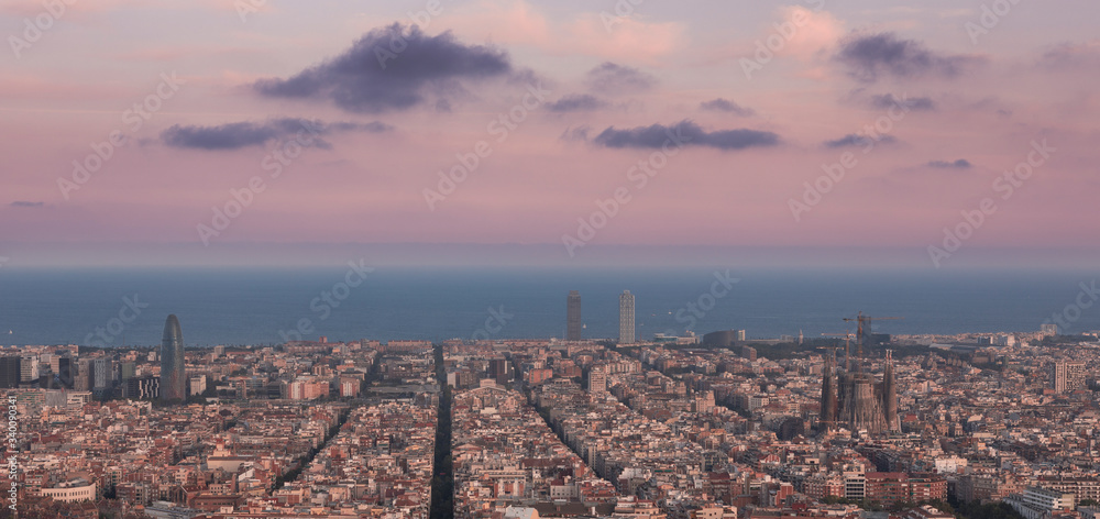 Skyline with cathedral Sagrada Familia in Barcelona during sunset, Bunkers del Carmel.