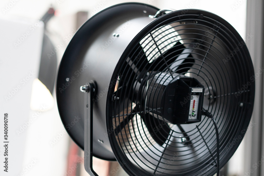 Isolated image of a fan working against a white background Isolated image of a fan working against a white background