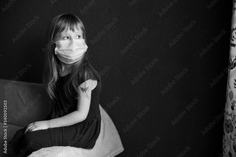 girl in a mask on self-isolation