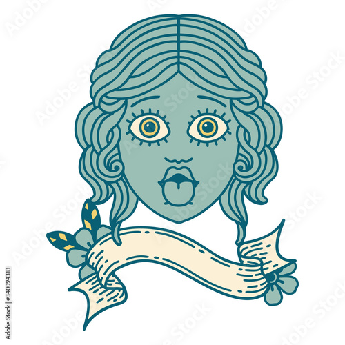 tattoo with banner of female face sticking out tongue