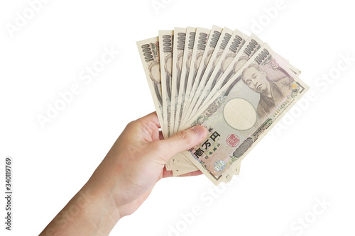 10万円を握る男性の手-白背景
