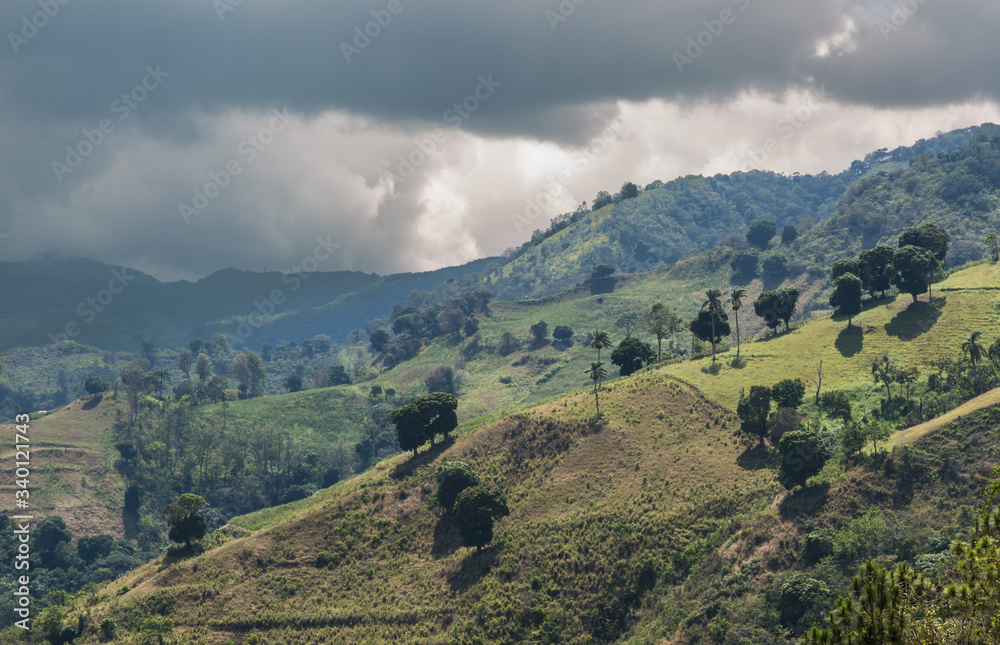 dramatic image of agricultural fields and farms high in the Caribbean mountains of the Dominican republic.