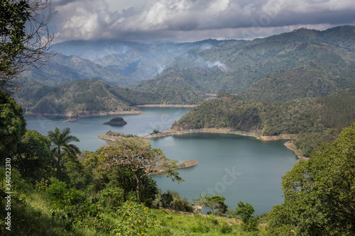 dramatic image of Presa Jiguey Dam highn in the caribbean mountains of the dominican republic. © Todd