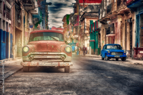 old classic cars parked on a street in Havana, cuba © javier