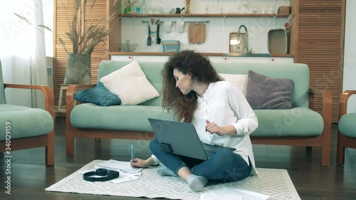 Gorgeous woman is working on a computer from home. Workimg from home during coronavirus pandemic. photo