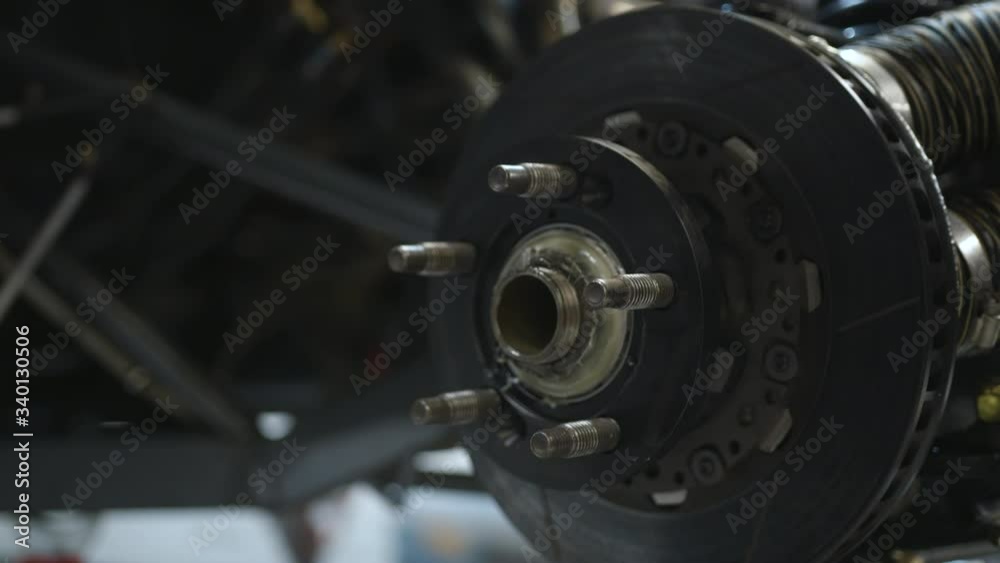 Car Repair by an Expert Mechanic, Close Up of Hands Working on Engine Car Repair by an Expert Mechanic, Close Up of Hands Working on Engine