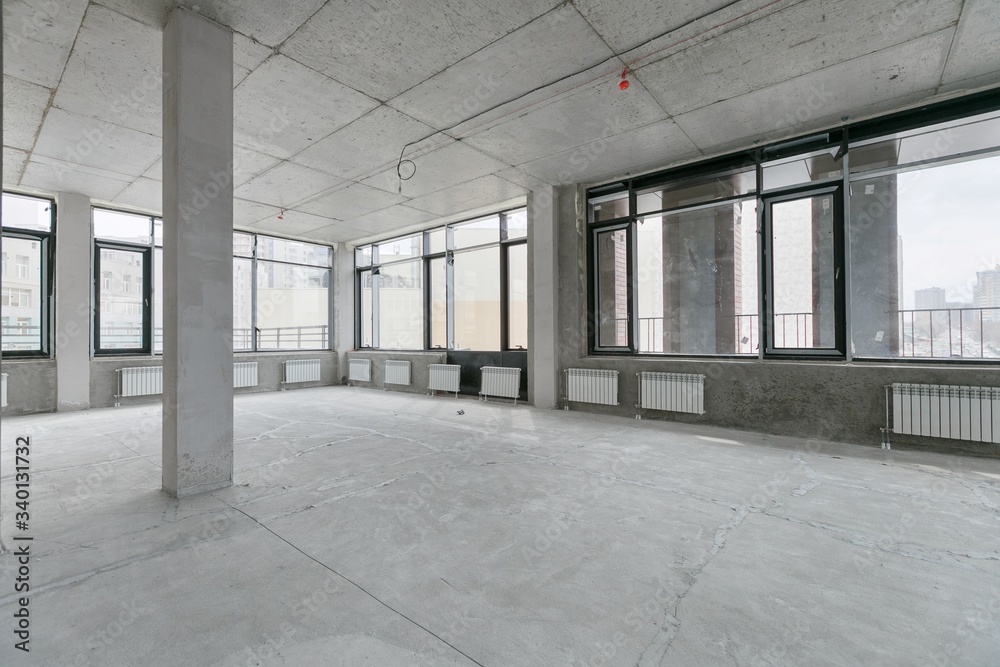 empty pure commercial office building undecorated in gray colors.open space office