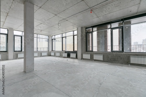 empty pure commercial office building undecorated in gray colors.open space office