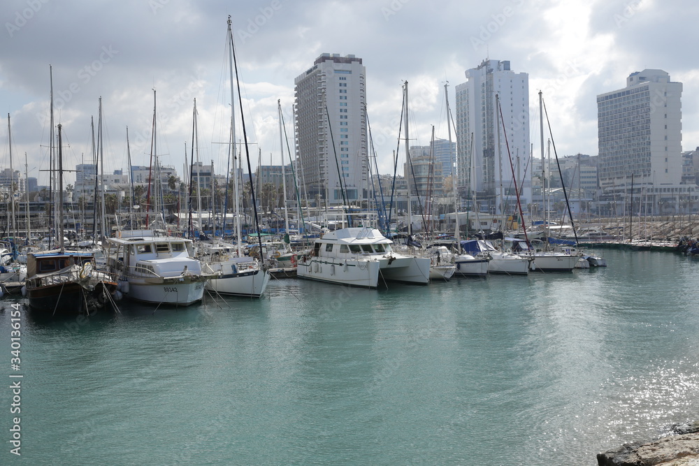 yacht marina in the Mediterranean Sea against the backdrop of a modern city