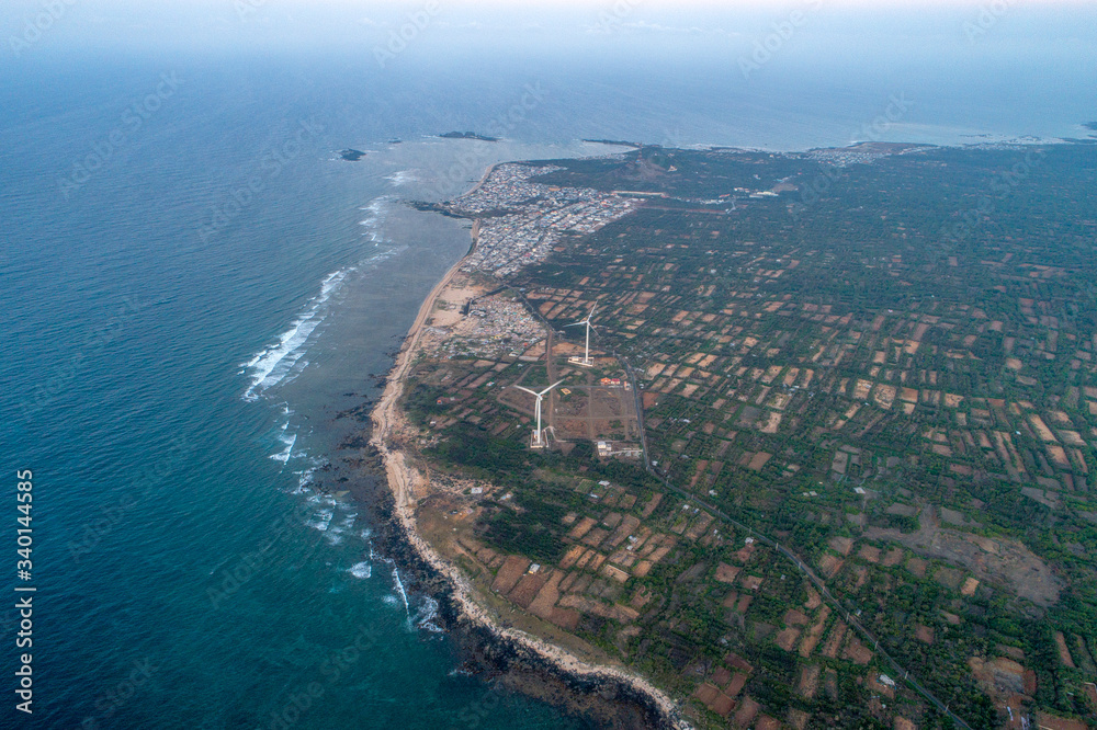 Aerial view of landscape with Turbine Green Energy Electricity, Windmill for electric power production, Wind turbines generating electricity  on Phu Qui island, Binh Thuan, Vietnam. 
