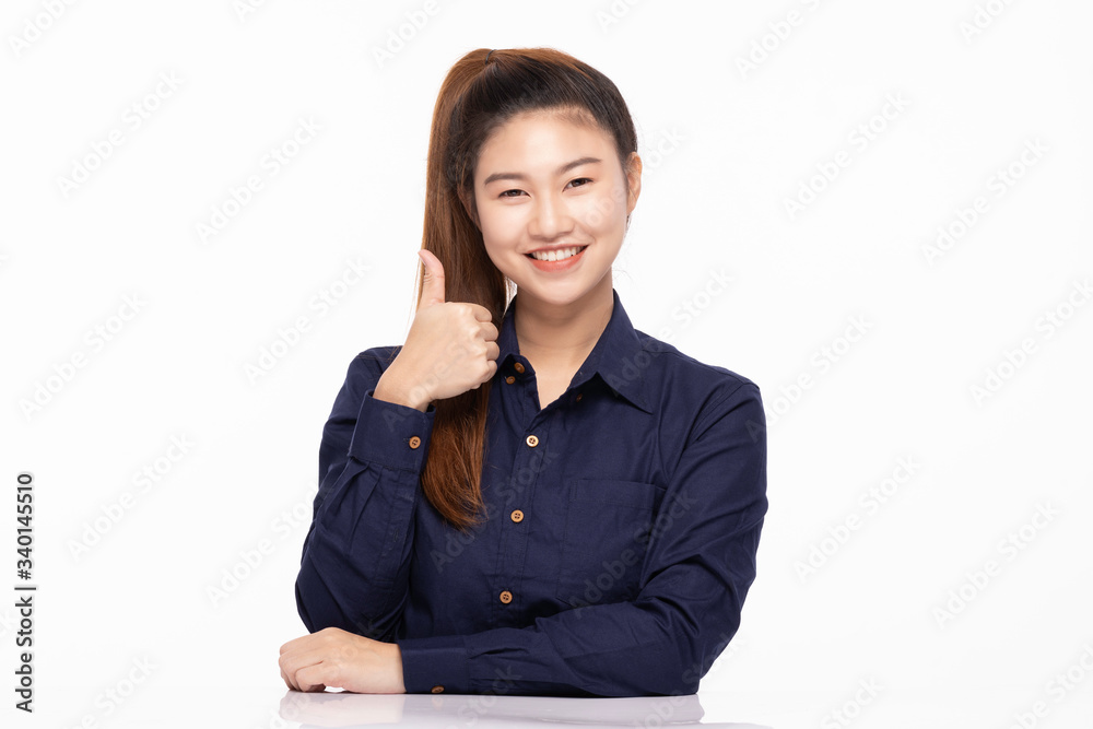 beautiful business Asian woman wearing blue shirt smile showing thumbs up for good sign with happiness and confident feeling,Isolated on white,Positive emotional beautiful business Asian woman wearing blue shirt smile showing thumbs up for good sign with happiness and confident feeling,Isolated on white,Positive emotional