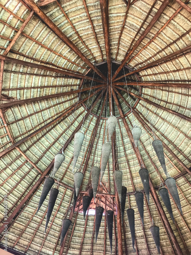 Tropical wood and straw ceiling dome with decoration hanging in the middle, Quintana Roo, México