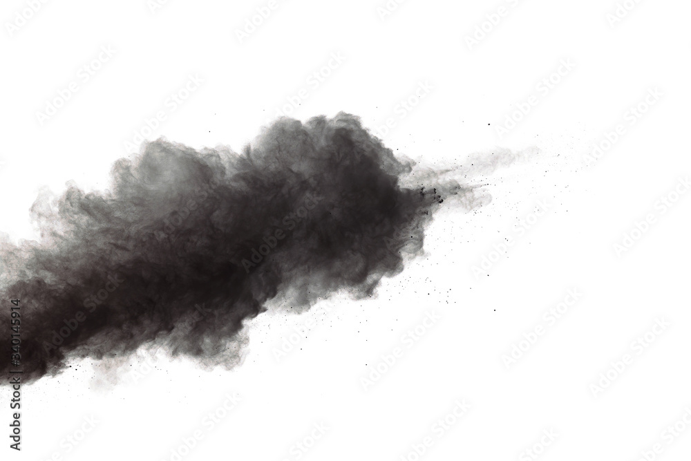 Fototapeta premium Black powder explosion. Closeup of black dust particles explode isolated on white background.