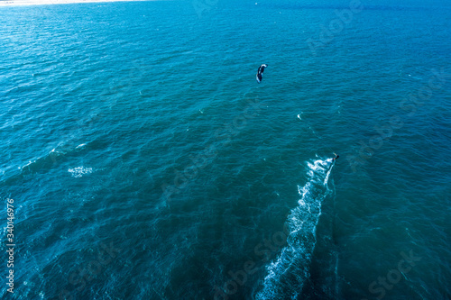 Aerial view of Kitesurfing on the waves of the sea in Mui Ne beach, Phan Thiet, Binh Thuan, Vietnam. Kitesurfing, Kiteboarding action photos