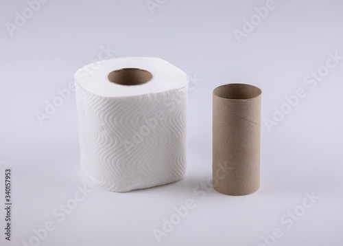 Photo of tissue rolls, before and after use which the core is made of paper brown cardboard and it is ready to recycle, show concept of changing, such as, diet for fat and thin, or young and old.