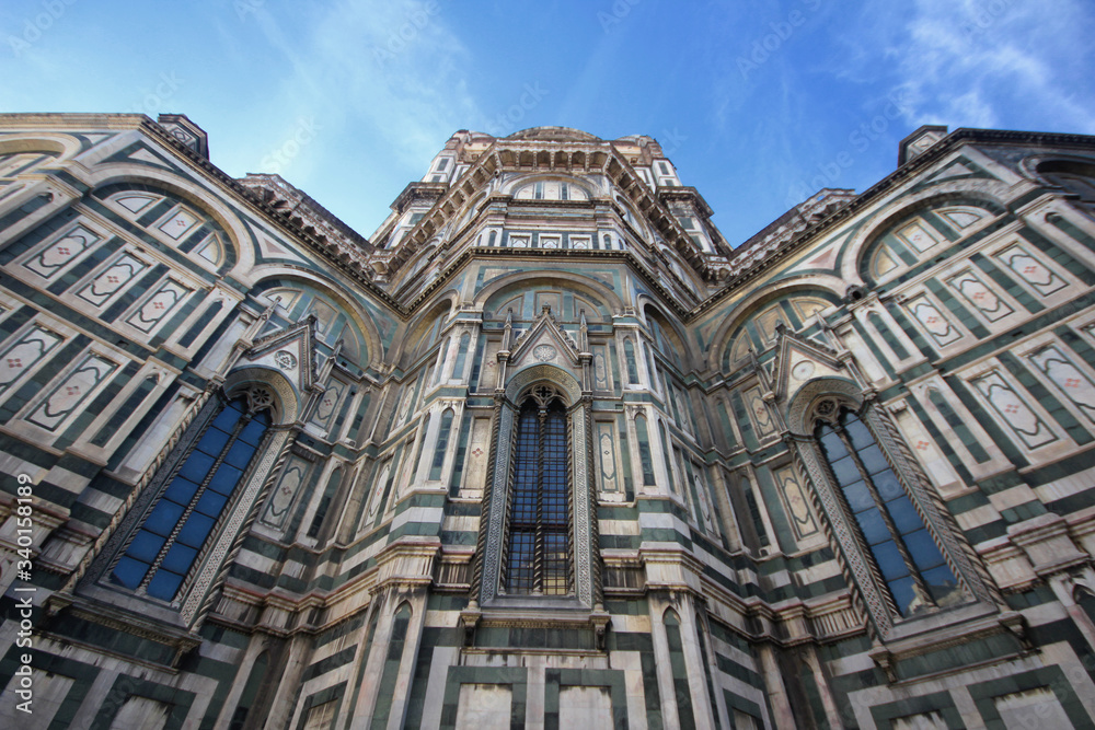 The marvellous art statue and painting decorated surrounding on Florance duomo, The mistery sculpture on Famous white Architectural cathedral church under blue sky at Florance, The largest church in I