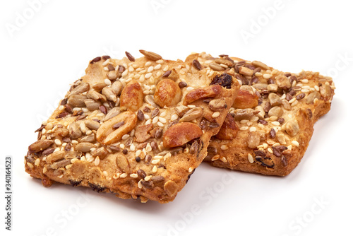 Cookies with nuts and seeds of peanut, sunflower seeds, sesame, linen, organic food, isolated on white background