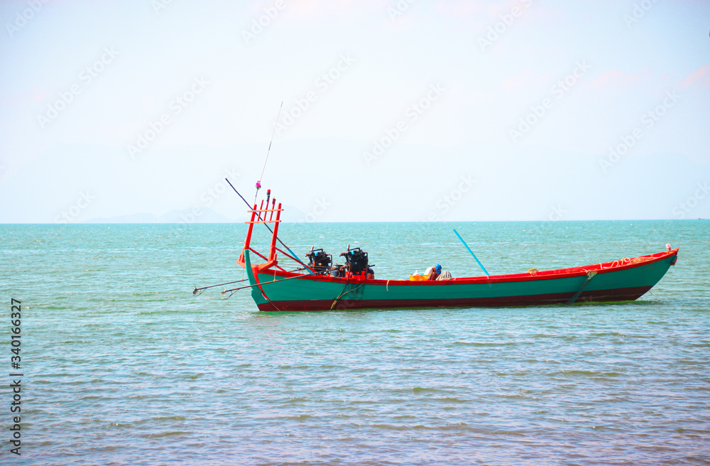 Traditional wooden khmer (Cambodian) fishing boat on the coast of Kep, showing the local culture and livelihood of the local people in Cambodia